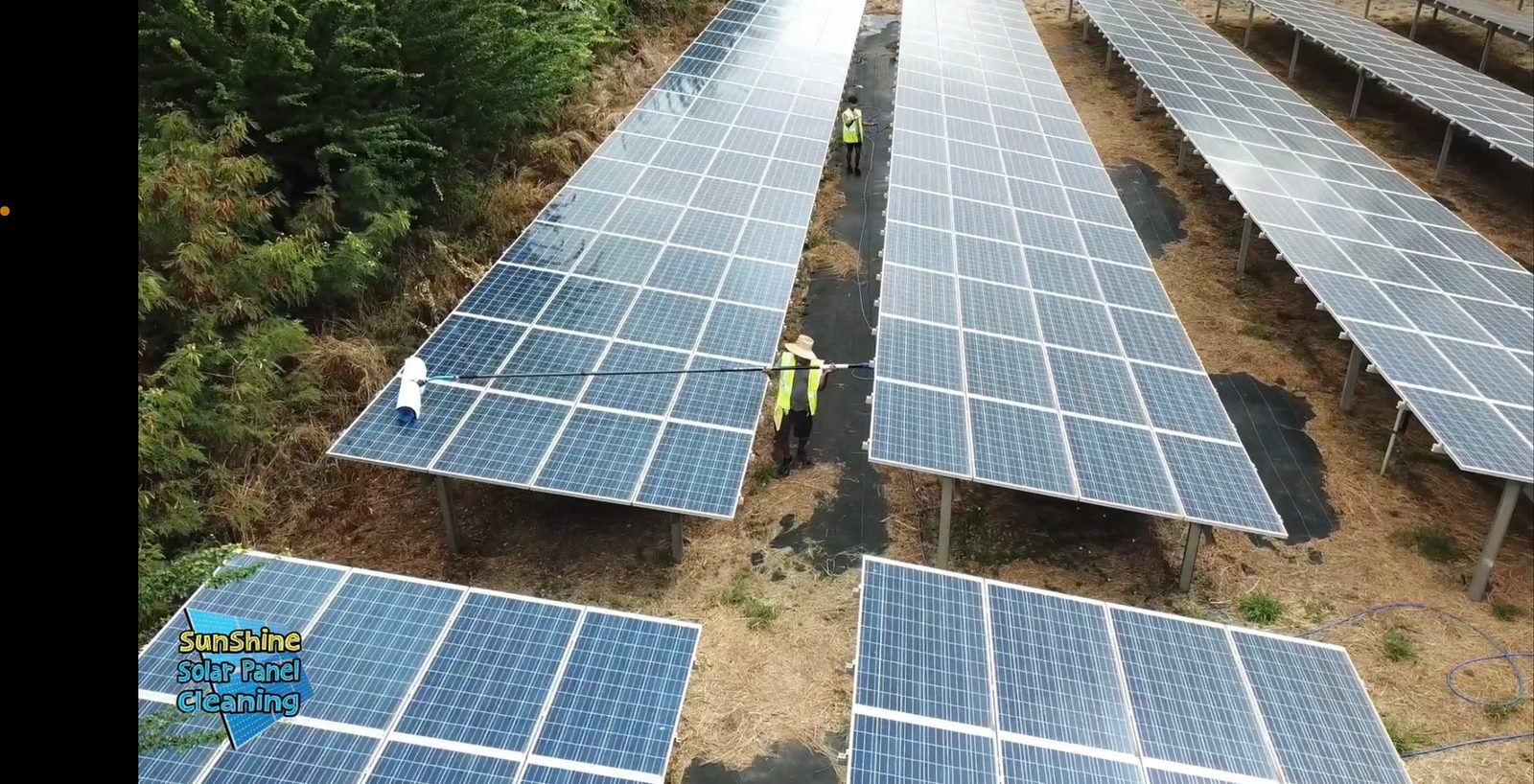Aerial view of a commercial solar array being cleaned on Oahu