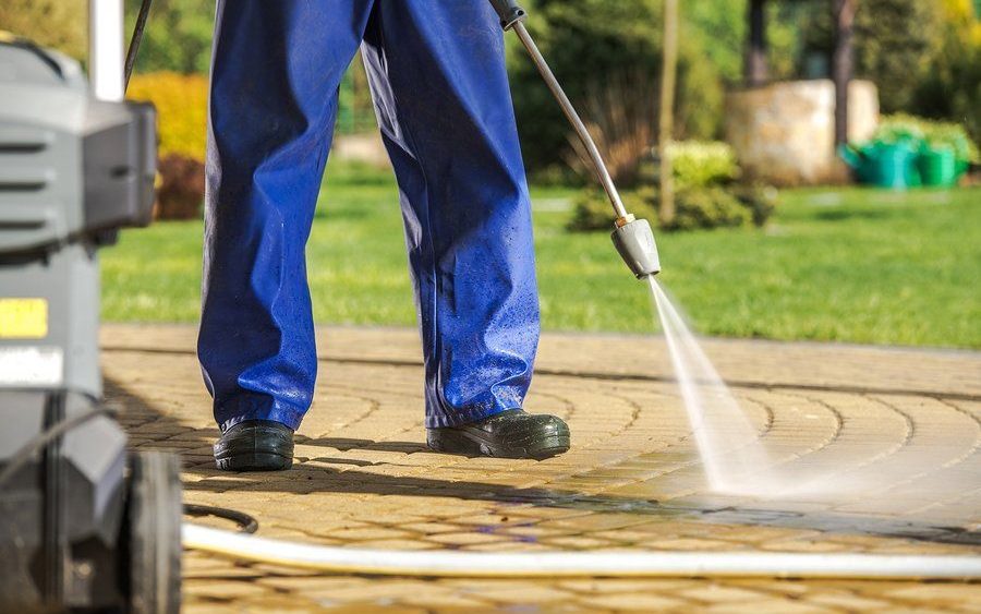 Power washing an exterior surface at an Oahu property